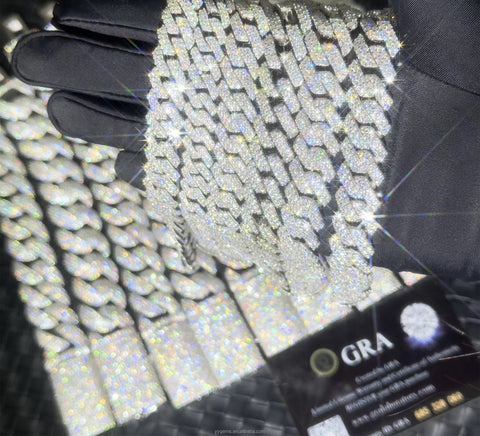 Close-up of a diamond-studded chain with a 'GRA' card