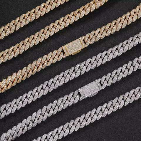 Gold and silver chain necklaces on a black background

