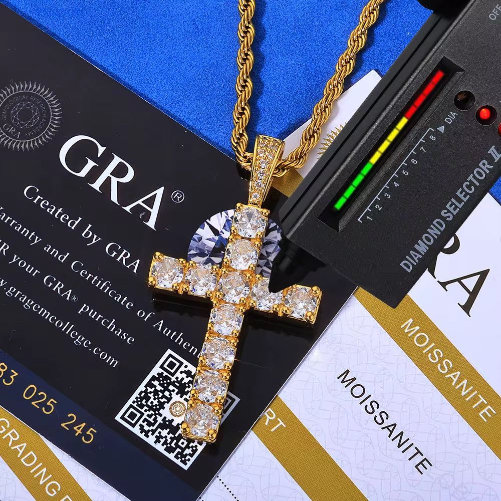 Gold cross pendant with diamonds on a blue and black background with GRA branding.