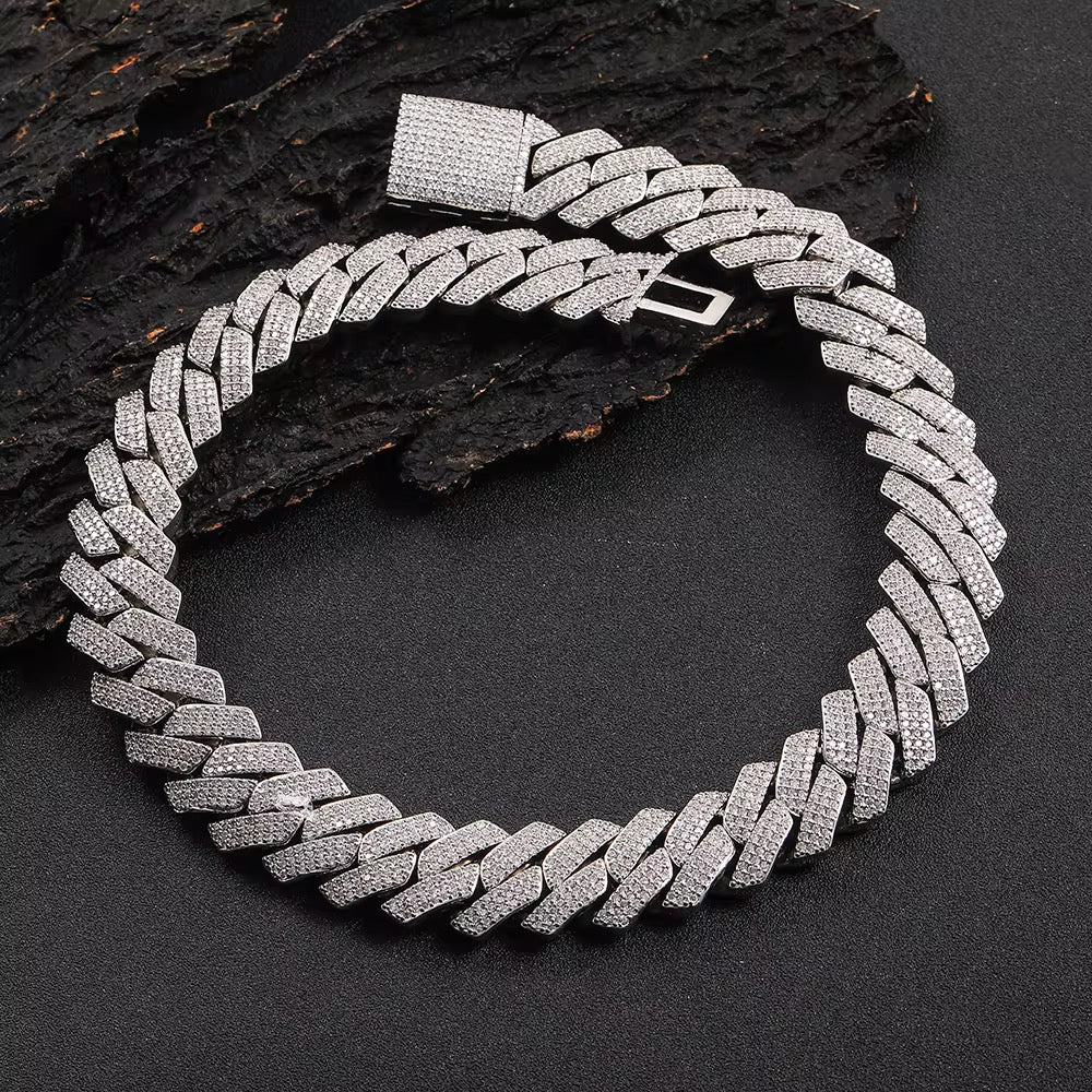 Silver chain necklace on a dark textured background

