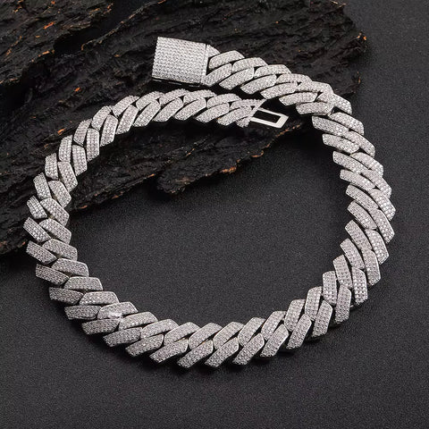 Silver chain necklace on a dark textured background

