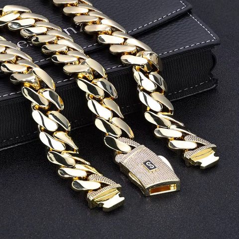 Gold chain belt with a clasp on a black background

