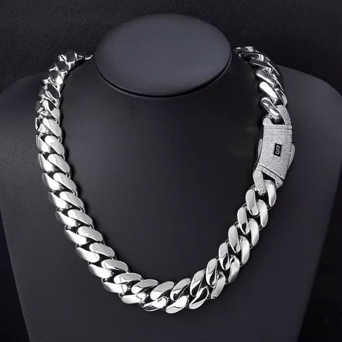 Silver chain necklace on a black mannequin bust

