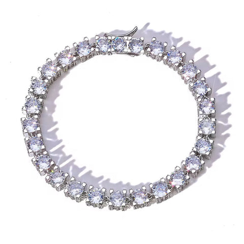 Silver bracelet with clear gemstones on a white background