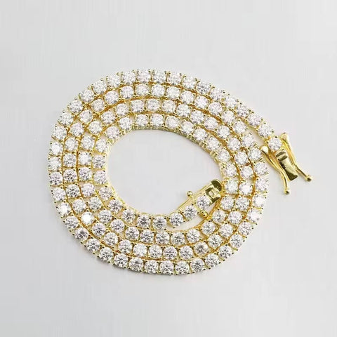 Gold and diamond bracelet on a light gray background

