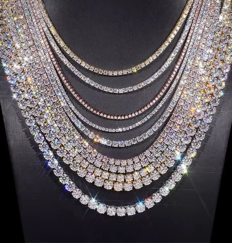 Multiple layers of sparkling diamond necklaces on a dark background