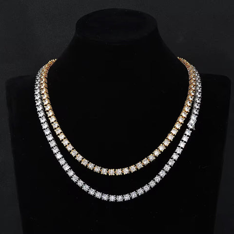 Two diamond necklaces on a black mannequin bust against a dark background

